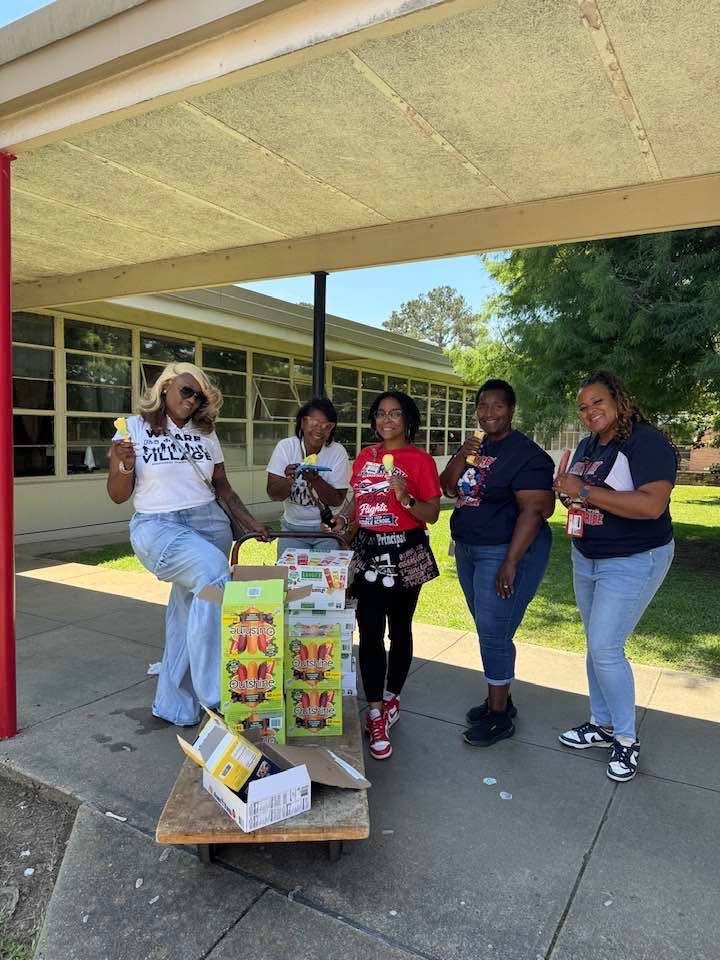 MIC volunteers and Shirley Elementary staff with boxes of frozen treats on field day
